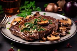 Keto gebakken biefstuk, Champignon recepten, Koolhydraatarme diner ideeën, Gebakken biefstuk met champignons, Eiwitrijke maaltijden, Keto vleesgerechten, Snelle keto diners, Keto biefstukrecepten, Boterachtige champignons, Keto hoofdgerechten, Culinaire keto, Klassieke biefstukrecepten, Keto dieet maaltijden, Gezonde vleesmaaltijden, Eenvoudige keto recepten.